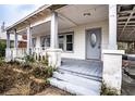 Inviting front porch with wooden floors and railings at 520 S 10Th St, Lake Wales, FL 33853