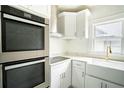 Modern kitchen featuring stainless steel appliances and white shaker cabinets at 520 S 10Th St, Lake Wales, FL 33853