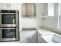 Modern kitchen with stainless steel appliances and white cabinets at 520 S 10Th St, Lake Wales, FL 33853