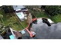 Property features a private dock, large backyard, and waterfront access at 952 N Heron Cir, Winter Haven, FL 33884