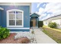 Welcoming entrance with walkway and landscaping at 1005 Corvina Dr, Davenport, FL 33897
