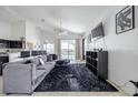Open-concept living space with a view of the pool at 1005 Corvina Dr, Davenport, FL 33897