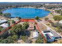 Aerial view showing home's lot size and lakefront location at 1107 Saint Anne Shrine Rd, Lake Wales, FL 33898