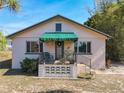 Charming one-story home with green awning and landscaped yard at 1107 Saint Anne Shrine Rd, Lake Wales, FL 33898
