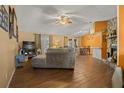Bright living room with tile floors, stone fireplace and comfortable seating at 1406 Chamberlain Loop, Lake Wales, FL 33853