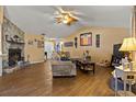 Spacious living area featuring tile floors and a cozy fireplace at 1406 Chamberlain Loop, Lake Wales, FL 33853