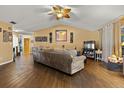 Living room with tile floors, a ceiling fan, and ample natural light at 1406 Chamberlain Loop, Lake Wales, FL 33853