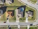 Aerial view showcasing a house with a pool in a residential neighborhood at 176 Brookshire Dr, Lake Wales, FL 33898