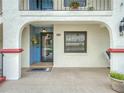 Inviting entrance with blue door, decorative wreath, and large window for natural light at 2002 Granada Ct # 1, Lake Wales, FL 33898