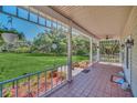 Spacious front porch overlooking a large grassy yard at 21113 Kissimmee Shores Rd, Lake Wales, FL 33898