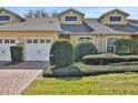 Two-story home with a two-car garage and well-manicured lawn at 2739 Rutledge Ct, Winter Haven, FL 33884