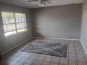 Bright living room featuring tile floors and a large window at 2790 Avenue L Nw, Winter Haven, FL 33881