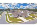 House in a residential neighborhood with a spacious yard at 304 Denna Ln, Auburndale, FL 33823