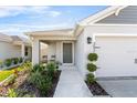 Inviting front porch with walkway and small green area at 3934 Palazzo Pl, Winter Haven, FL 33884