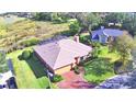One-story house with a screened-in pool and spacious yard at 514 Lake Mariam Ter, Winter Haven, FL 33884