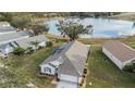 Single-story home with lake view, screened patio, and spacious yard at 524 Lake Suzanne Dr, Lake Wales, FL 33859