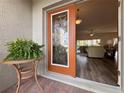 Open front door revealing a view of the living room at 5341 Nicklaus Dr, Winter Haven, FL 33884