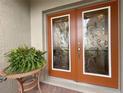 Elegant double front doors with etched glass accents at 5341 Nicklaus Dr, Winter Haven, FL 33884