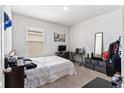 Bright bedroom with double bed, desk, and ample closet space at 716 Brooklet Dr, Davenport, FL 33837