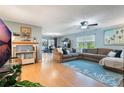 Comfortable living room with hardwood floors, ceiling fan and lots of seating at 768 Canberra Rd, Winter Haven, FL 33884