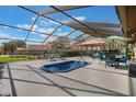 Enclosed pool area with comfortable lounge furniture, perfect for relaxation and outdoor entertaining at 768 Canberra Rd, Winter Haven, FL 33884