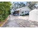Charming single-story home featuring a spacious driveway and shed for extra storage at 1048 Sunset Trail, Babson Park, FL 33827