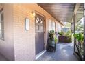 Inviting front porch with a charming front door and space for decorative plants at 115 Jefferson St, Lake Wales, FL 33859