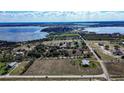 Expansive property showcasing the home's proximity to lakes and surrounding landscapes at 1815 Adams Barn Rd, Lake Alfred, FL 33850