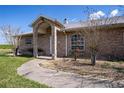 Arched entryway and manicured landscaping highlights the home's curb appeal at 1815 Adams Barn Rd, Lake Alfred, FL 33850