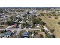 Aerial view of neighborhood and landscape featuring greenery and homes at 1817 Mckeown Ave, Haines City, FL 33844