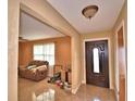 Inviting entryway with tile floors and a view into the living room at 20 24Th Sw St, Winter Haven, FL 33880