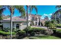 Attractive side view of home featuring architectural details, manicured landscaping and a beautiful brick driveway at 3312 Eagles Trce, Winter Haven, FL 33884