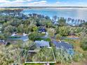 Aerial view of the community, showcasing lush greenery and a nearby lake at 4 Lake Eloise Ln, Winter Haven, FL 33884