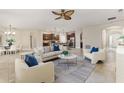Open-concept living room with adjacent kitchen and dining area at 452 Palastro Ave, Auburndale, FL 33823