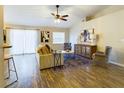 Bright living room with vaulted ceiling, wood floors, and stylish furnishings at 4639 Great Blue Heron Dr, Lakeland, FL 33812