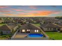 Aerial view of backyard featuring an above-ground pool and fenced yard at 4924 Saint James St, Winter Haven, FL 33881