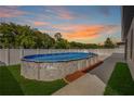 Backyard view of an above-ground pool with ample deck space at 4924 Saint James St, Winter Haven, FL 33881