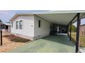 Attractive single-story home showcasing a convenient carport, golf cart, and clean exterior at 6059 Southern Oaks Se Dr, Winter Haven, FL 33884