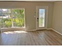 Bright living room featuring a decorative front door and a large window for ample natural light at 618 Chester Dr, Lakeland, FL 33803