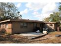 The backyard features a concrete patio and fenced-in yard; perfect for outdoor entertaining and relaxation at 807 S 1St St, Lake Wales, FL 33853