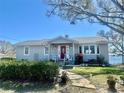 Charming single-story home with a welcoming front porch and well-maintained landscaping at 1050 E Eagle Ave, Eagle Lake, FL 33839