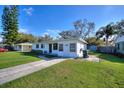 Charming single-story home with a well-manicured lawn and cozy front entrance at 1229 Rawls Dr, Lakeland, FL 33801