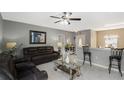 Inviting living room with modern tile flooring and stylish furnishings at 1817 Manitoba Ct, Poinciana, FL 34759
