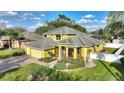 Two-story home featuring a landscaped front yard, brick walkway, and three car garage at 1904 Eloise Cove Dr, Winter Haven, FL 33884