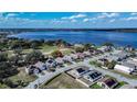 Aerial view of waterfront community with lake views and mature trees at 2706 Rochelle Dr, Winter Haven, FL 33881