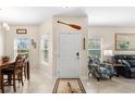 Inviting home entryway featuring tile floors, bright natural light, and a view into the living spaces at 2824 Attwater Loop, Winter Haven, FL 33884