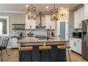 Modern kitchen with granite countertops, stainless steel appliances, and a central island with seating at 3834 Bedford Ave, Winter Haven, FL 33884