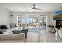 Bright living room with tile floors and sliding doors opening to a scenic outdoor space at 3943 Chambers St, Lake Wales, FL 33898
