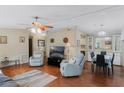 Comfortable living room with plush seating, a ceiling fan, and views of the dining area at 6053 Southern Oaks Se Dr, Winter Haven, FL 33884