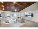 Comfortable living room with wood ceilings and open floor plan at 7016 Village Dr, Lake Wales, FL 33898